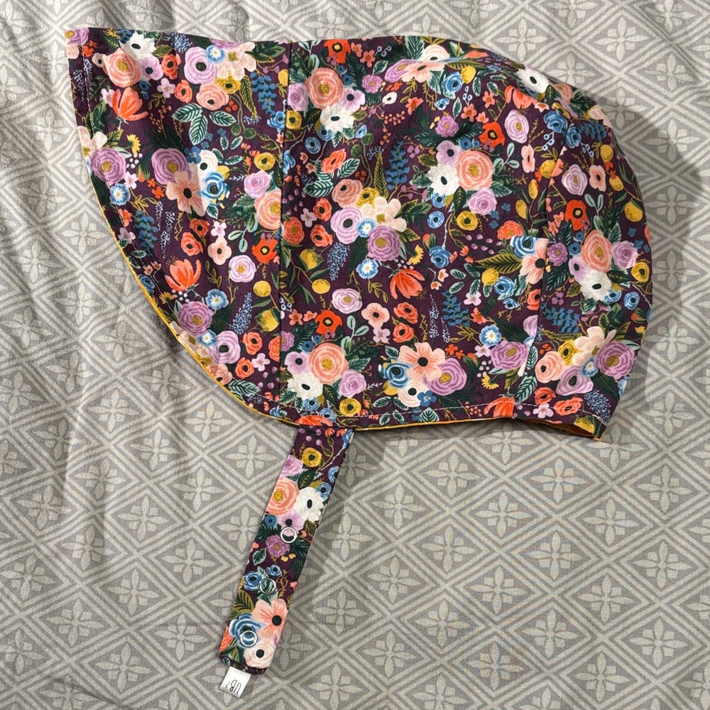 Urban baby bonnet reversible organic cotton bonnet in vibrant floral /yellow sun